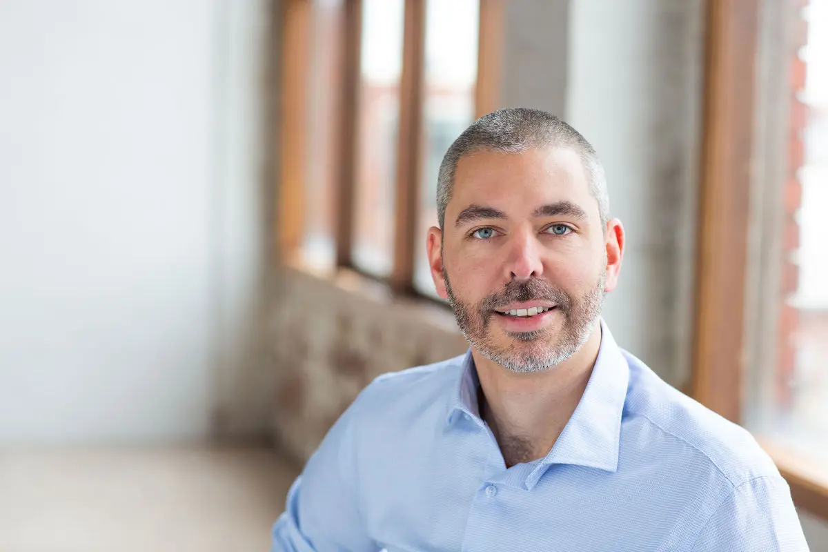 Professional headshot of Christian Findlay, Director of Nimblesite, wearing a business suit against a neutral background